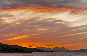 Skye & Small Isles cruise, sunset over Rum by Nigel Spencer