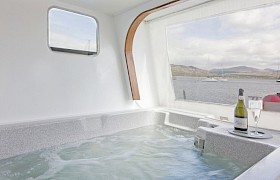 The hot tub with access to the lower aft deck