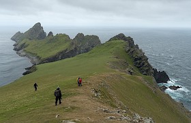 Guests on Hirta with Dun in the background. Photo Chris Gomersall