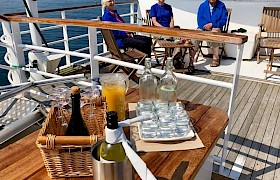 drinks on deck in the sunshine
